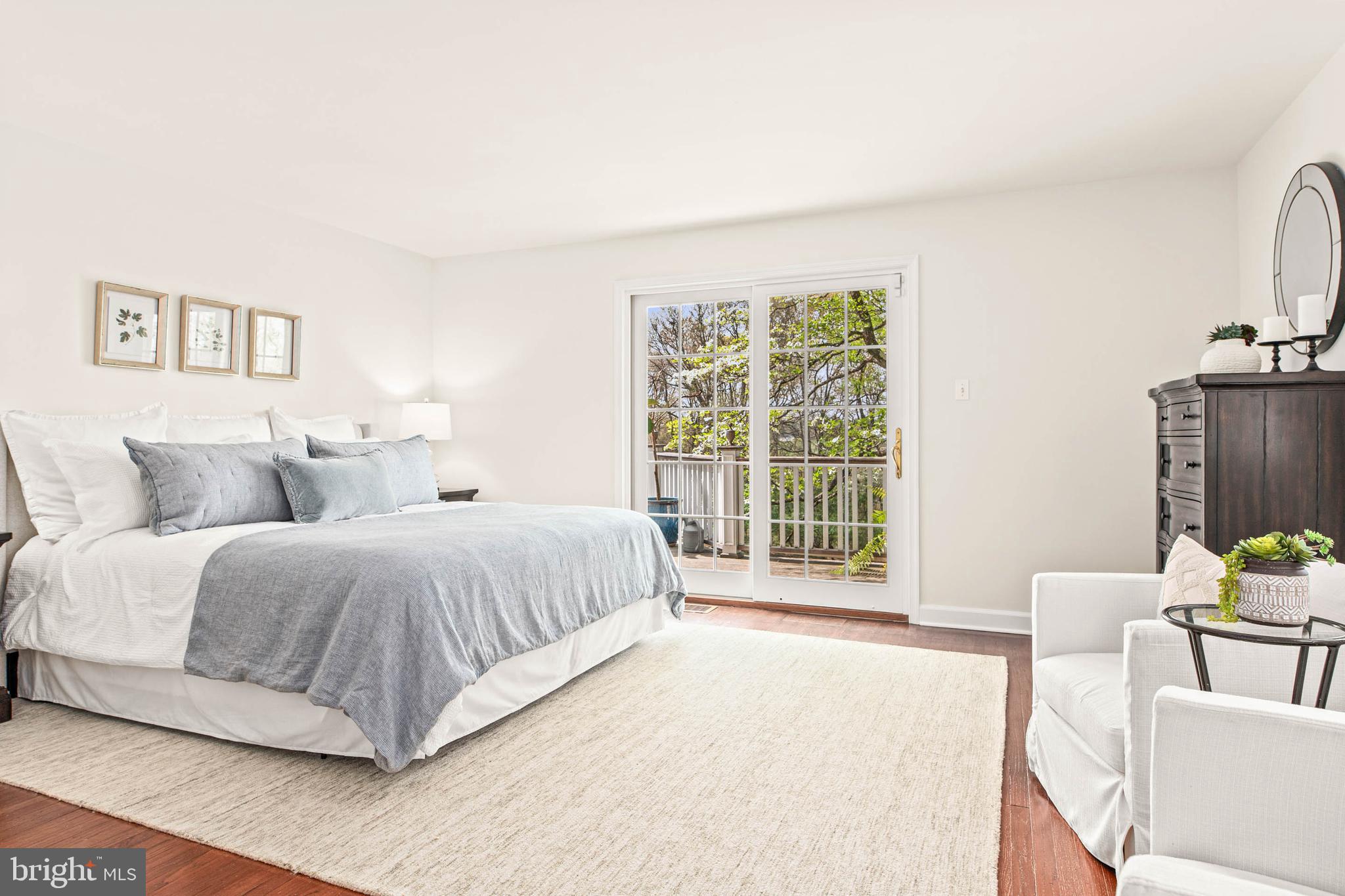 8 Rabbit Run Road Malvern, PA 19355 - Photo 22 of 49 a spacious bedroom with a bed and a large window