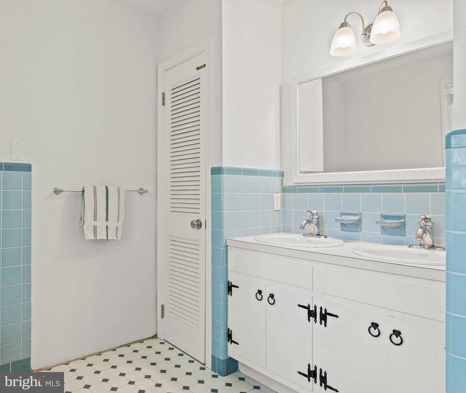 8 Rabbit Run Road Malvern, PA 19355 - Photo 25 of 49 a bathroom with a sink and a mirror