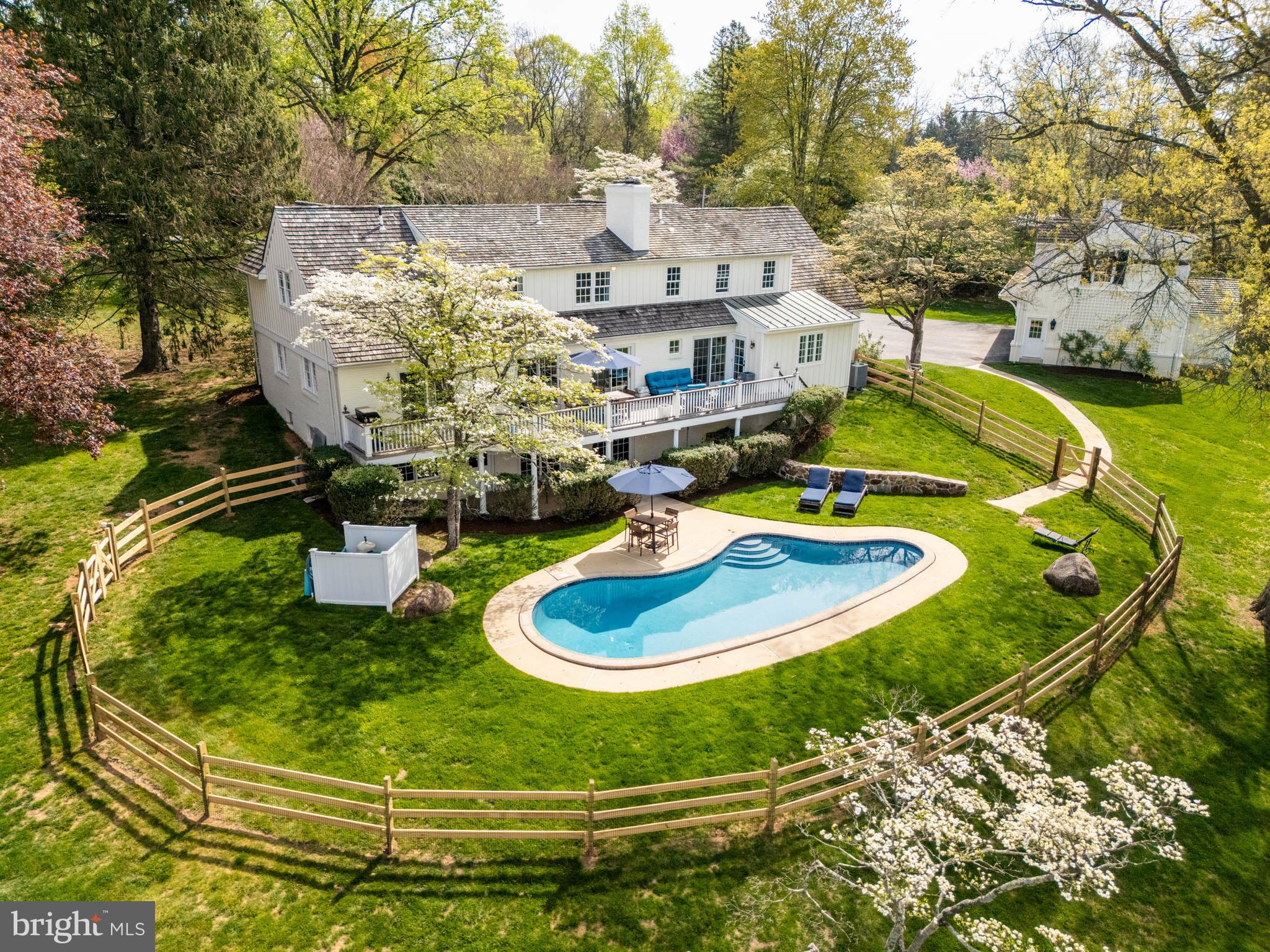 8 Rabbit Run Road Malvern, PA 19355 - Photo 4 of 49 a view of a swimming pool with a yard
