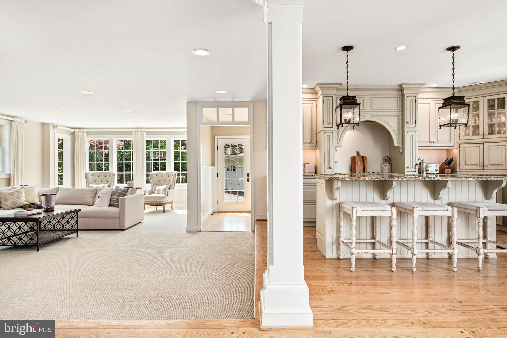 8 Rabbit Run Road Malvern, PA 19355 - Photo 9 of 49 a living room with fireplace furniture and a chandelier