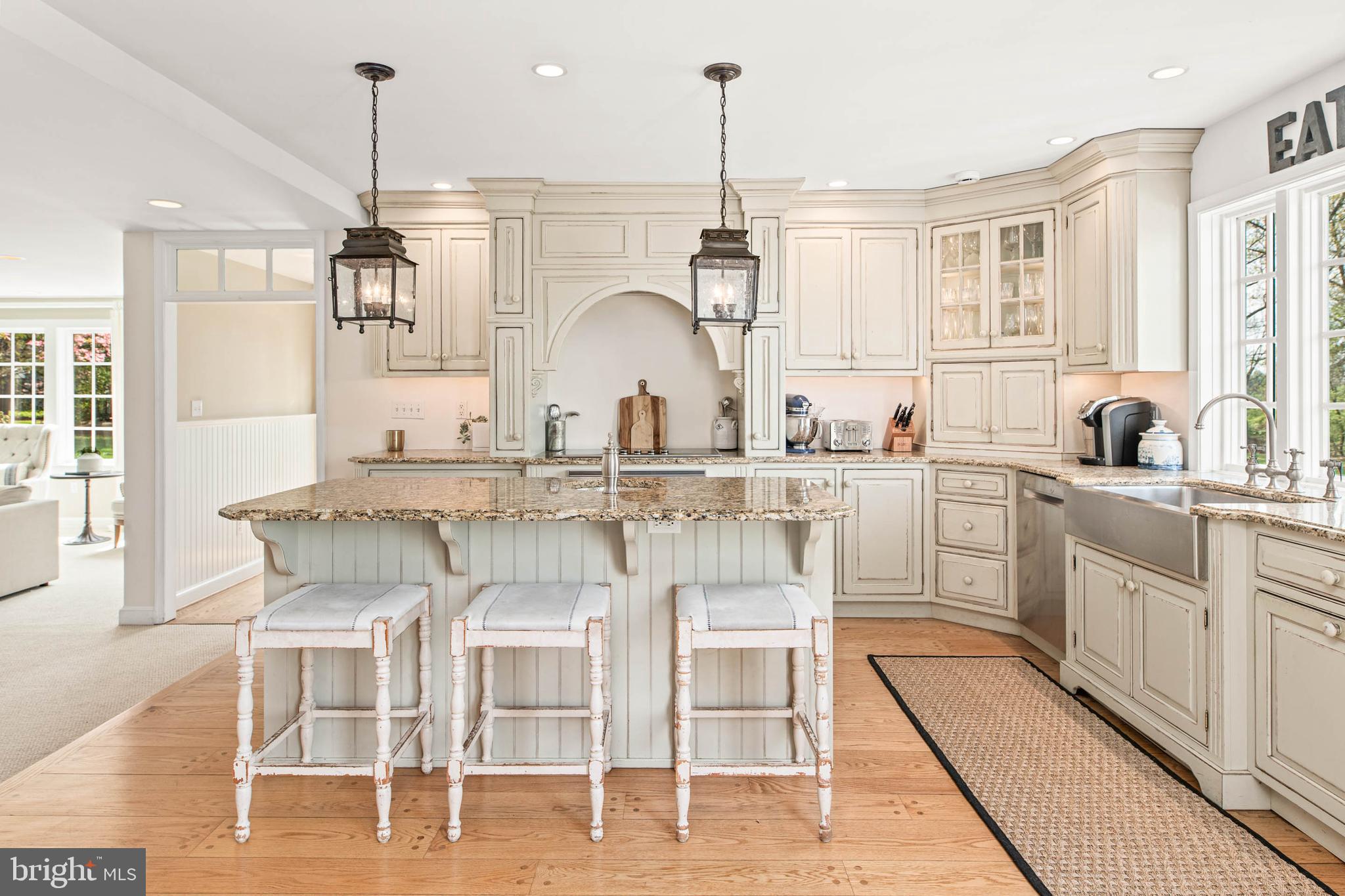 8 Rabbit Run Road Malvern, PA 19355 - Photo 10 of 49 a kitchen with cabinets and chairs