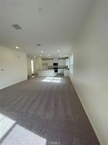 a view of a kitchen with a sink and cabinets
