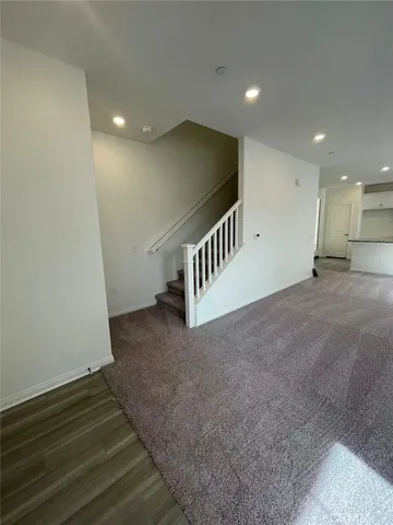 a view of an empty room and a window