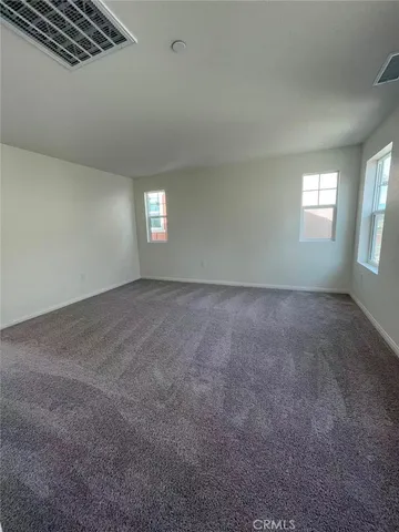 a large bathroom with a large mirror vanity and a sink