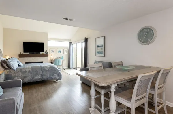 a bedroom with furniture and a flat screen tv