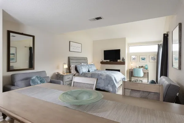 a living room with furniture flat screen tv and a fireplace