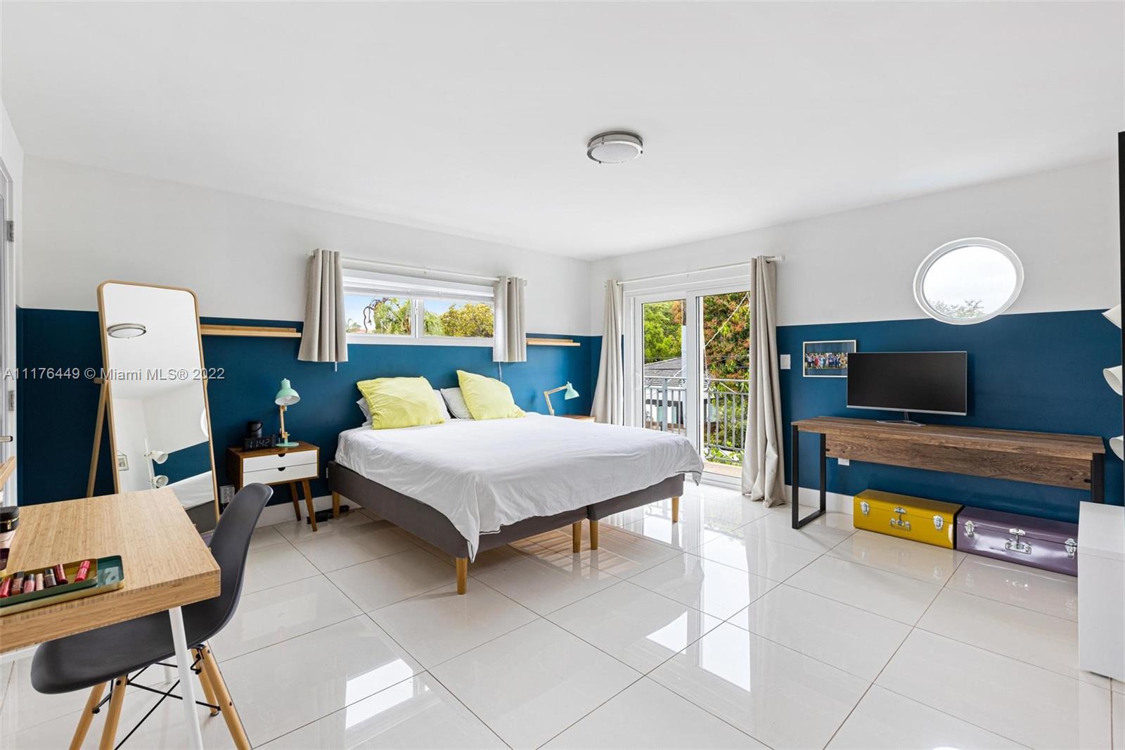 1910 Coral Gate Drive Miami, FL 33145 - Photo 14 of 39 a bedroom with furniture and a flat screen tv