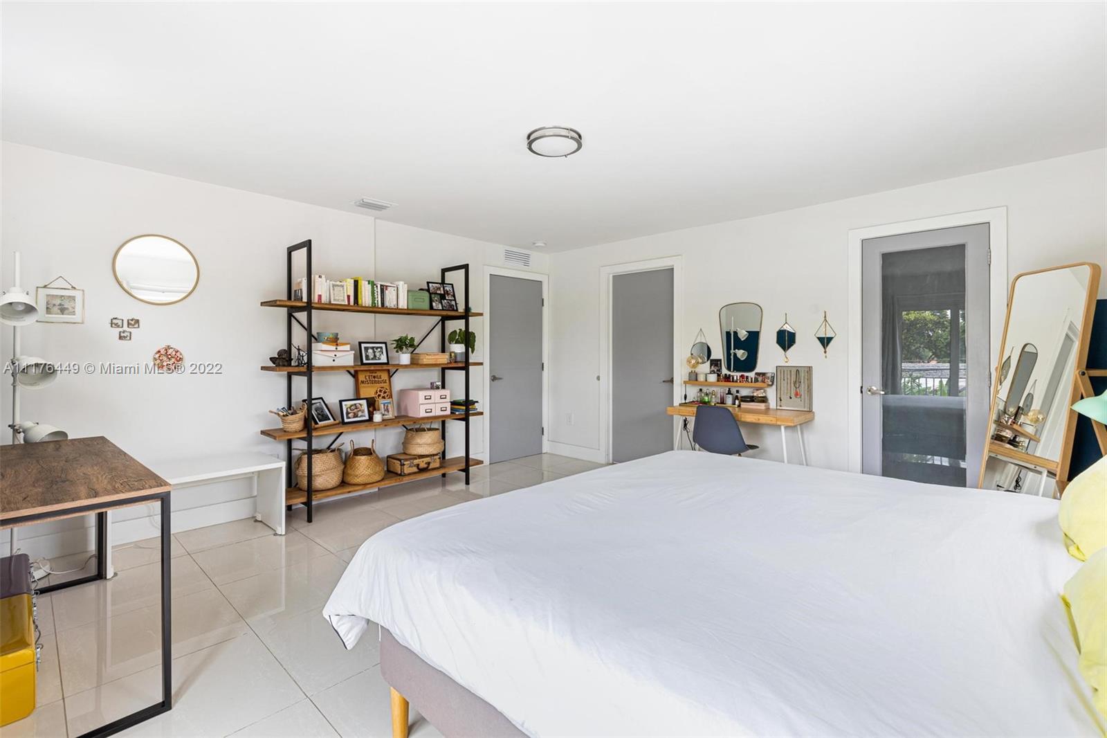 1910 Coral Gate Drive Miami, FL 33145 - Photo 16 of 39 a bed room with a bed and a chair