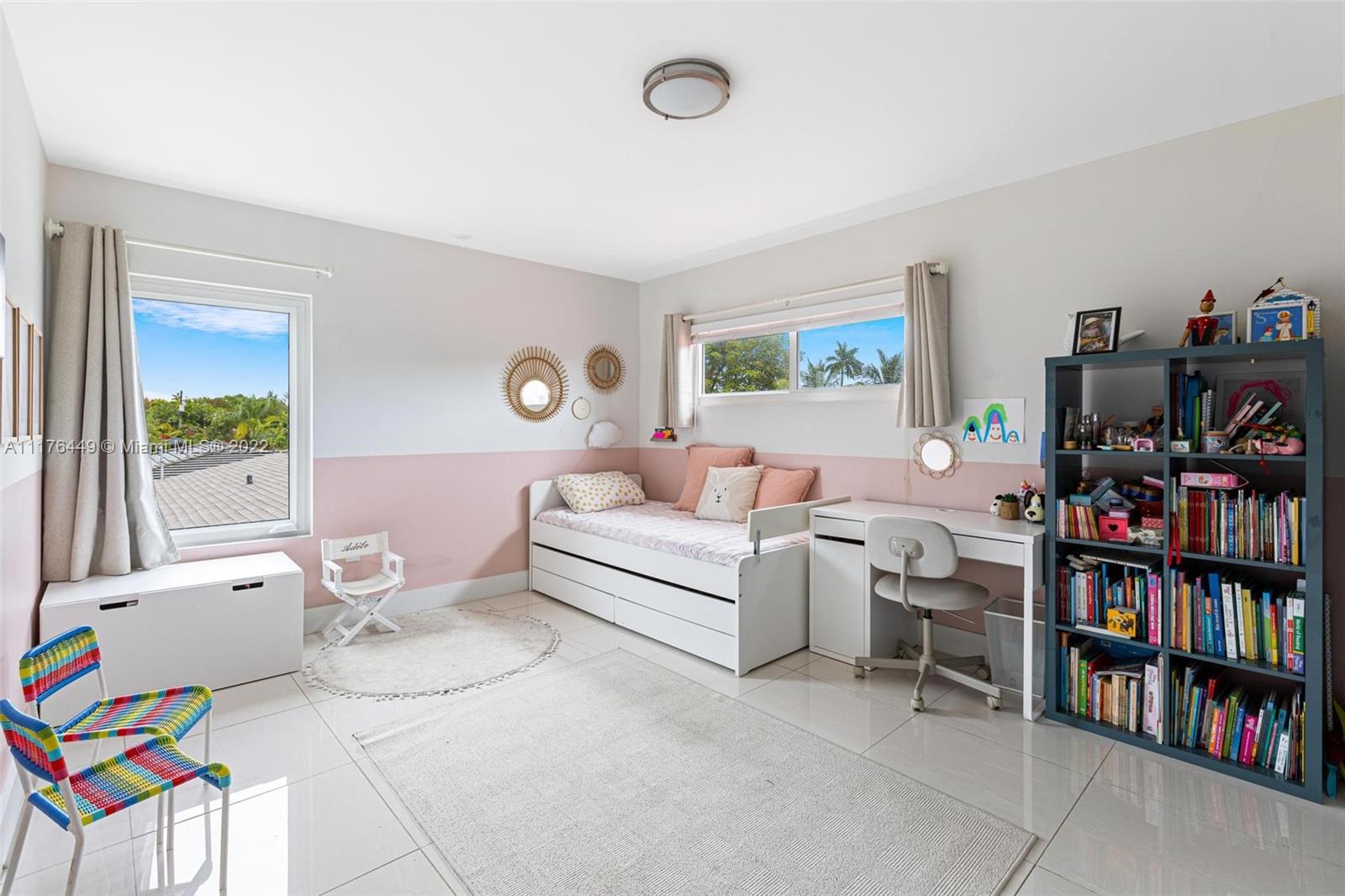 1910 Coral Gate Drive Miami, FL 33145 - Photo 18 of 39 a living room with furniture and a book shelf