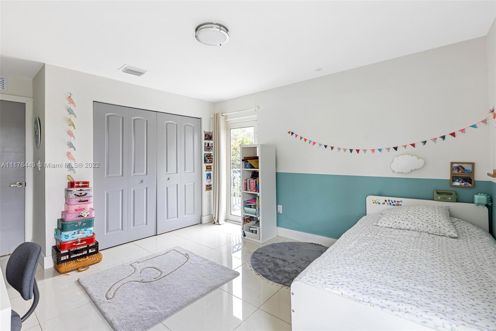 1910 Coral Gate Drive Miami, FL 33145 - Photo 21 of 39 a bedroom with bed and cabinets