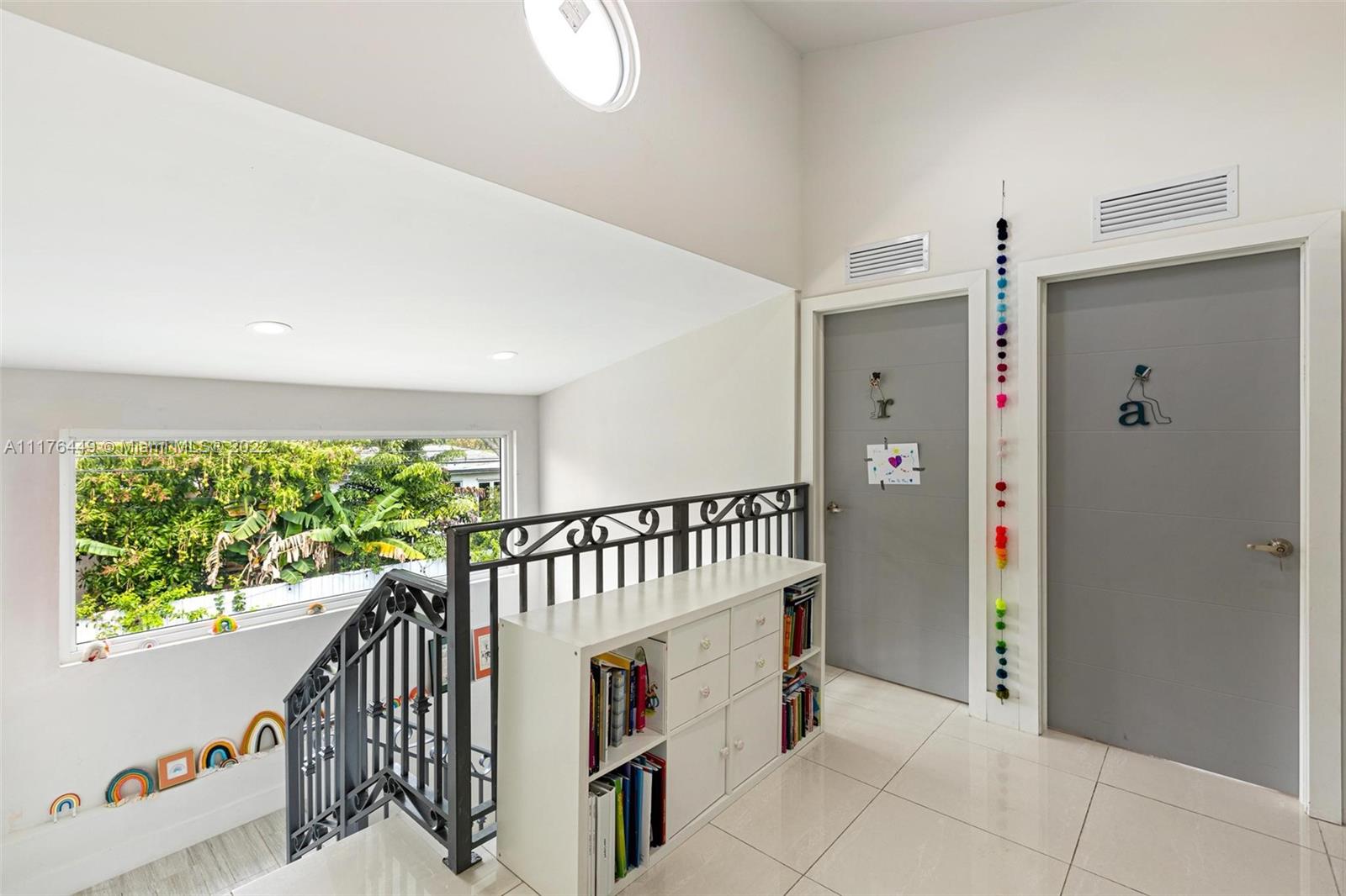 1910 Coral Gate Drive Miami, FL 33145 - Photo 24 of 39 a view of a hallway with windows