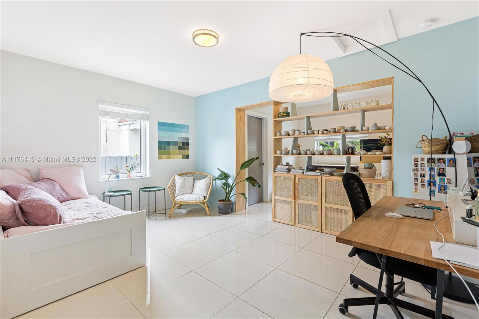 1910 Coral Gate Drive Miami, FL 33145 - Photo 26 of 39 a living room with furniture a chandelier and a table