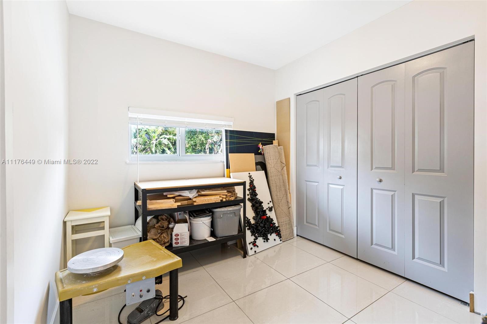 1910 Coral Gate Drive Miami, FL 33145 - Photo 27 of 39 a bedroom with furniture and a window