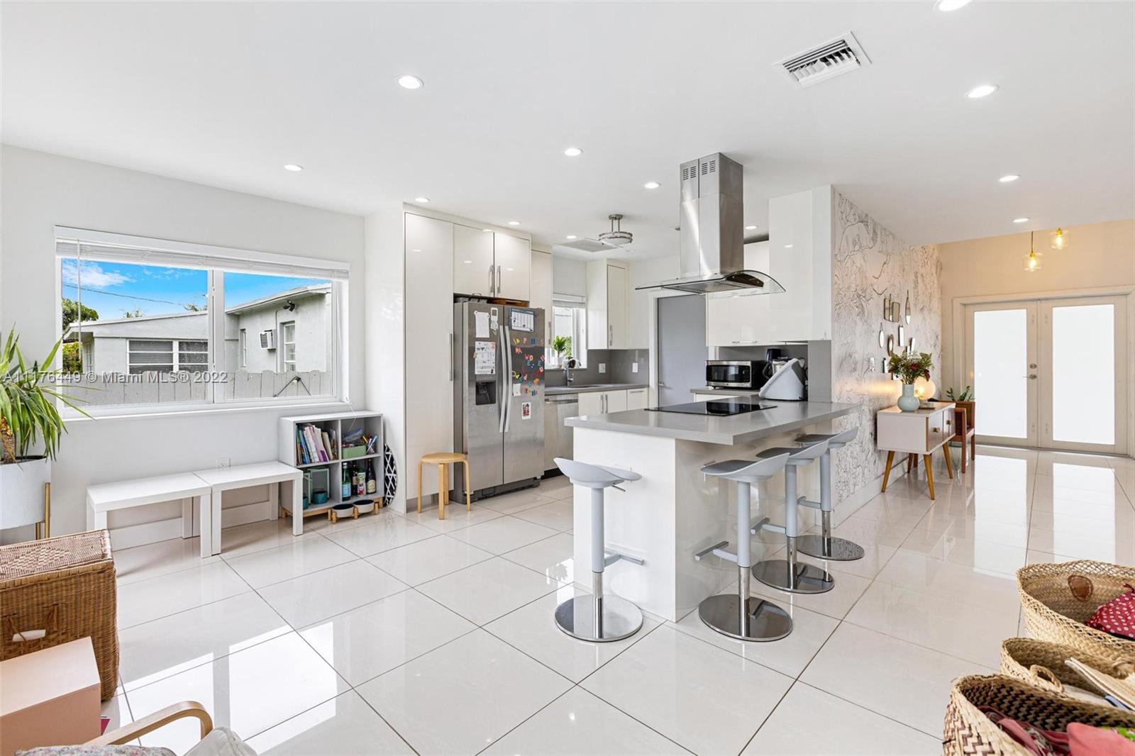 1910 Coral Gate Drive Miami, FL 33145 - Photo 8 of 39 a kitchen with stainless steel appliances kitchen island granite countertop a refrigerator and cabinets