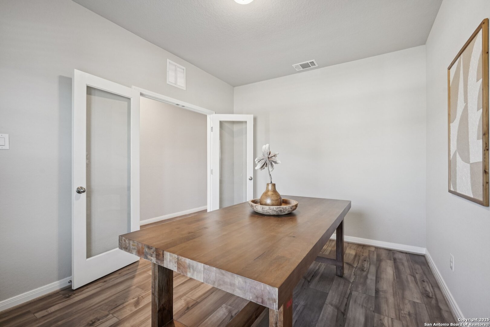 3311 Junction Bay Converse, TX 78109 - Photo 21 of 50 a view of a room that has a table and chairs in wooden floor