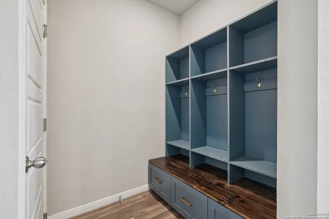 a view of a bedroom with washer and dryer