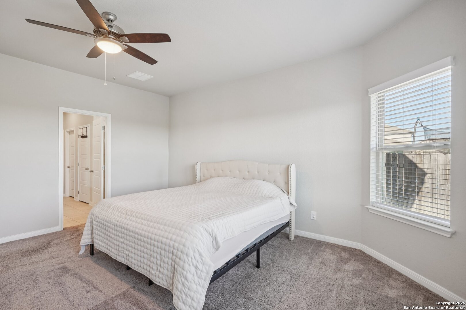 3311 Junction Bay Converse, TX 78109 - Photo 28 of 50 a bedroom with a bed and a window