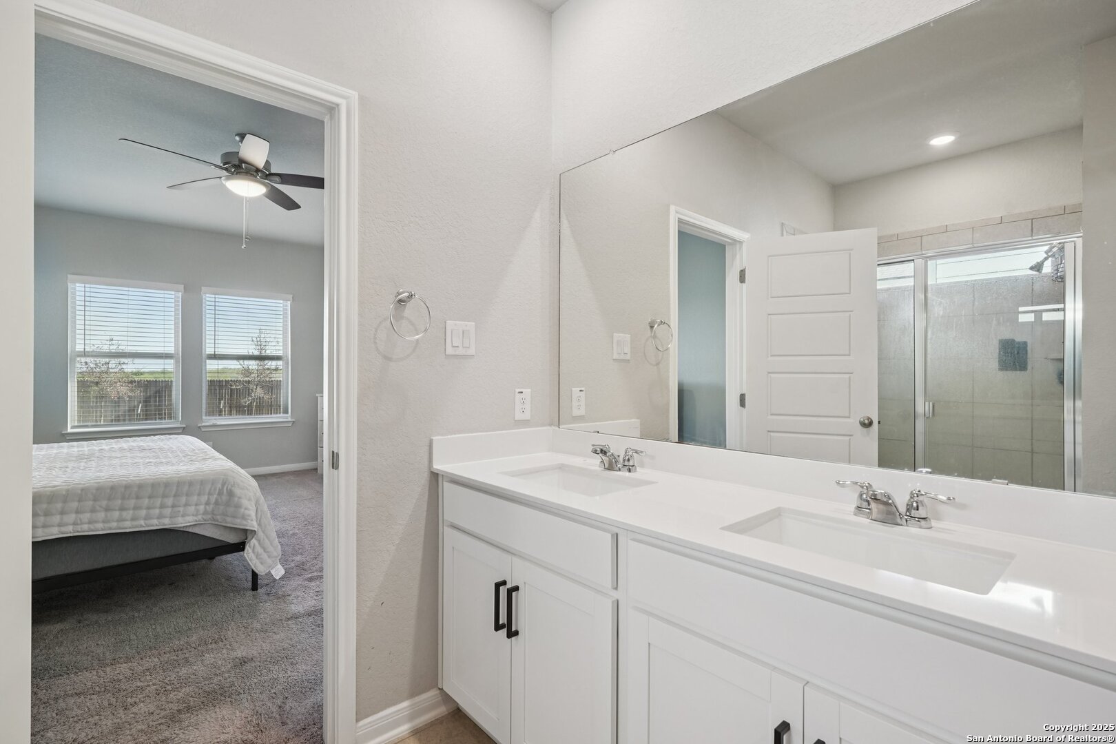 3311 Junction Bay Converse, TX 78109 - Photo 30 of 50 a en suite bathroom with a double vanity sink and mirror