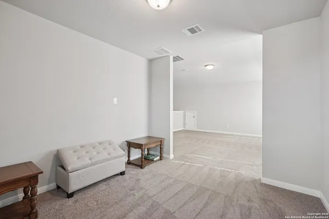 a bathroom with a double vanity sink toilet and a mirror