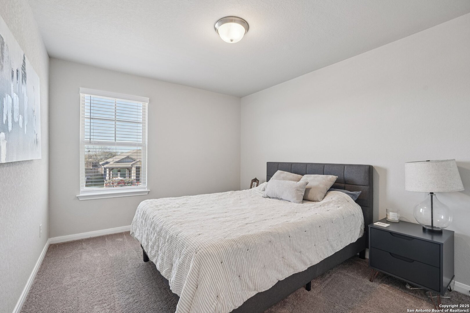 3311 Junction Bay Converse, TX 78109 - Photo 43 of 50 a bedroom with a bed and a window