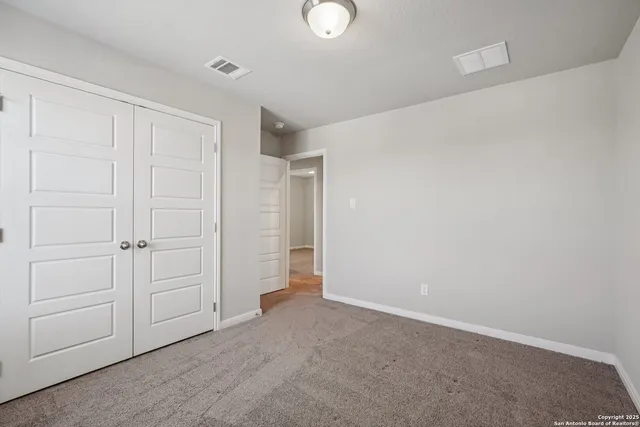 a view of a backyard with chair and table