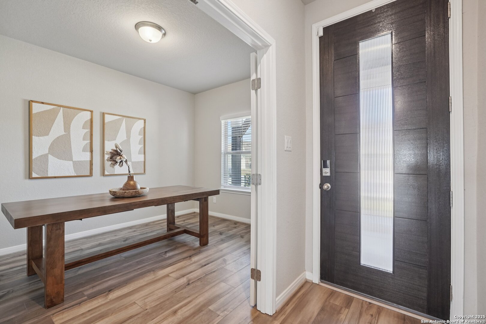 3311 Junction Bay Converse, TX 78109 - Photo 5 of 50 a view of a hallway with wooden floor and stairs