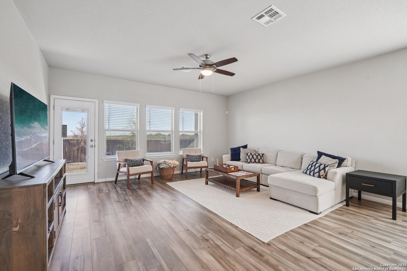 3311 Junction Bay Converse, TX 78109 - Photo 8 of 50 a living room with furniture and a flat screen tv