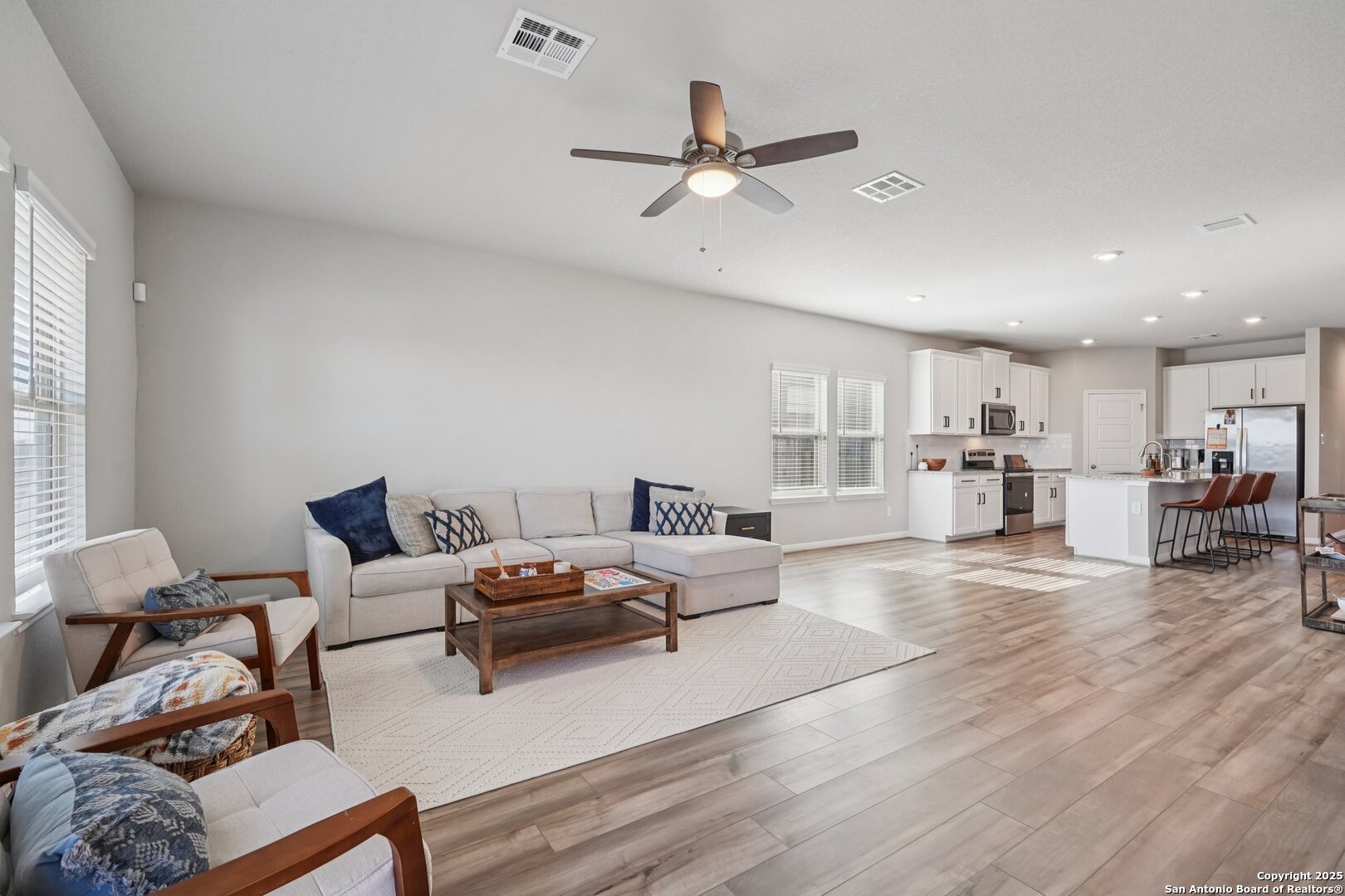 3311 Junction Bay Converse, TX 78109 - Photo 9 of 50 a living room with furniture and kitchen view