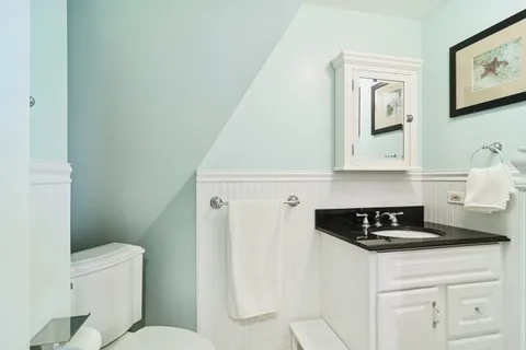 a kitchen with a refrigerator and cabinets