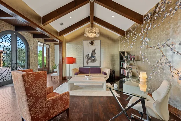a living room with furniture and a large window