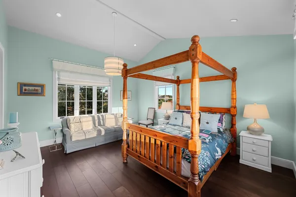 a bedroom with furniture and a window