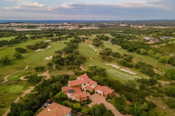 an aerial view of residential houses with outdoor space