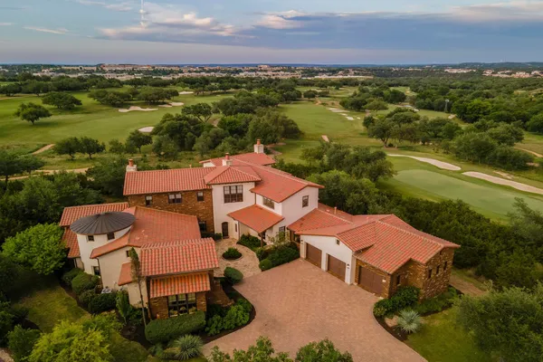 an aerial view of residential house with outdoor space