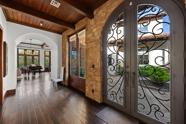 an entryway with wooden floor