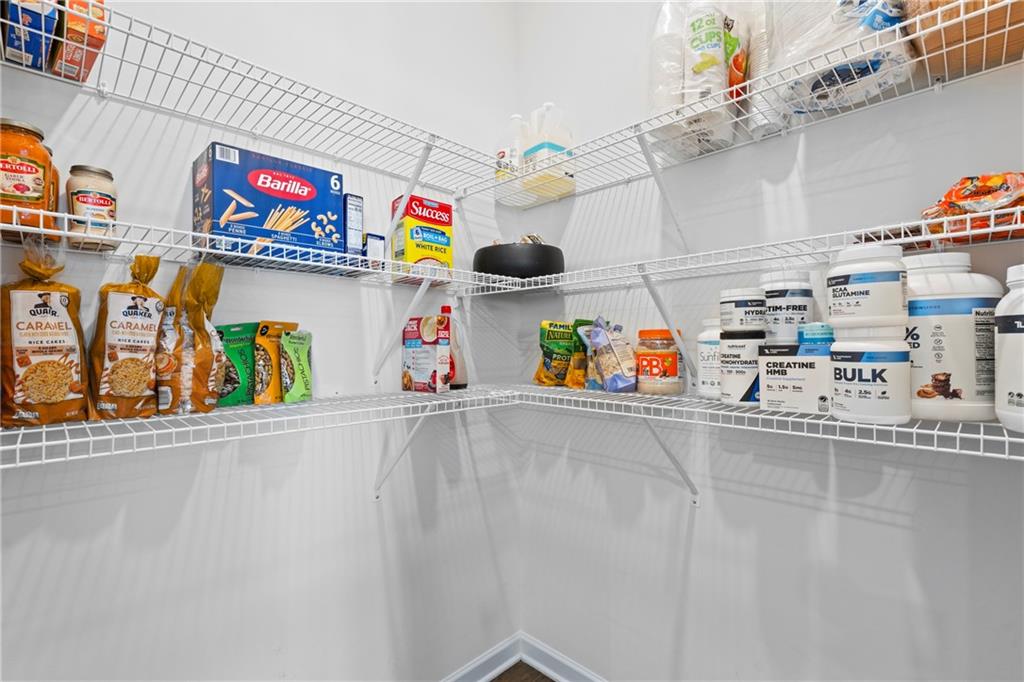 5367 Pennington Court Atlanta, GA 30349 - Photo 11 of 33 a utility room with lots of clutter and cabinets