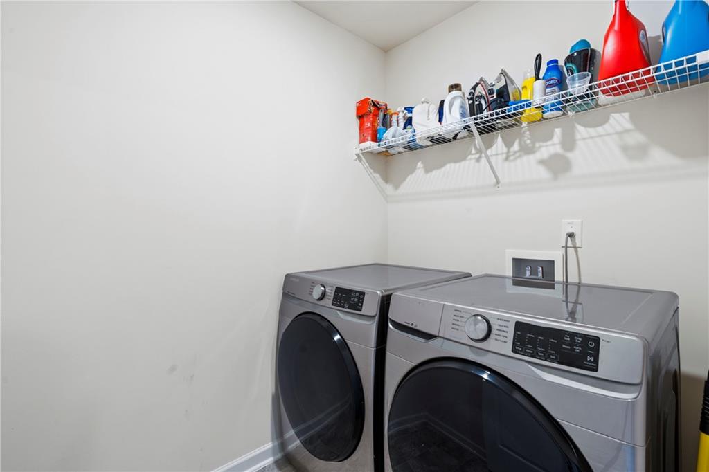 5367 Pennington Court Atlanta, GA 30349 - Photo 12 of 33 a utility room with dryer and washer