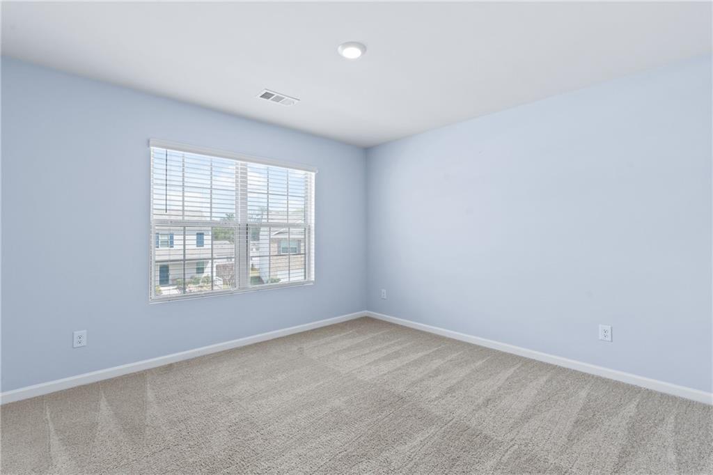 5367 Pennington Court Atlanta, GA 30349 - Photo 25 of 33 an empty room with a window
