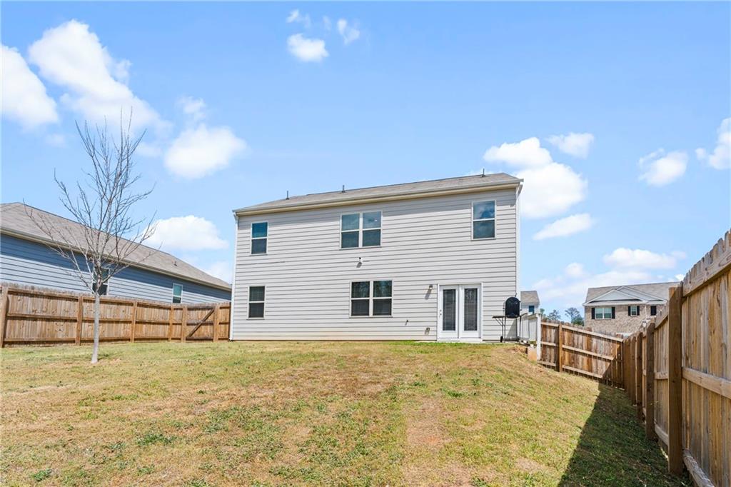5367 Pennington Court Atlanta, GA 30349 - Photo 33 of 33 a front view of a house with a yard