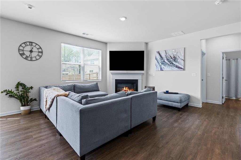5367 Pennington Court Atlanta, GA 30349 - Photo 5 of 33 a living room with furniture and a flat screen tv