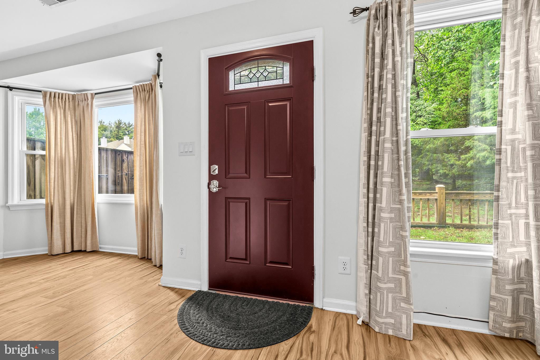 6001 Rabbit Hill Court Centreville, VA 20121 - Photo 3 of 46 a view of a hallway with wooden floor and a livingroom