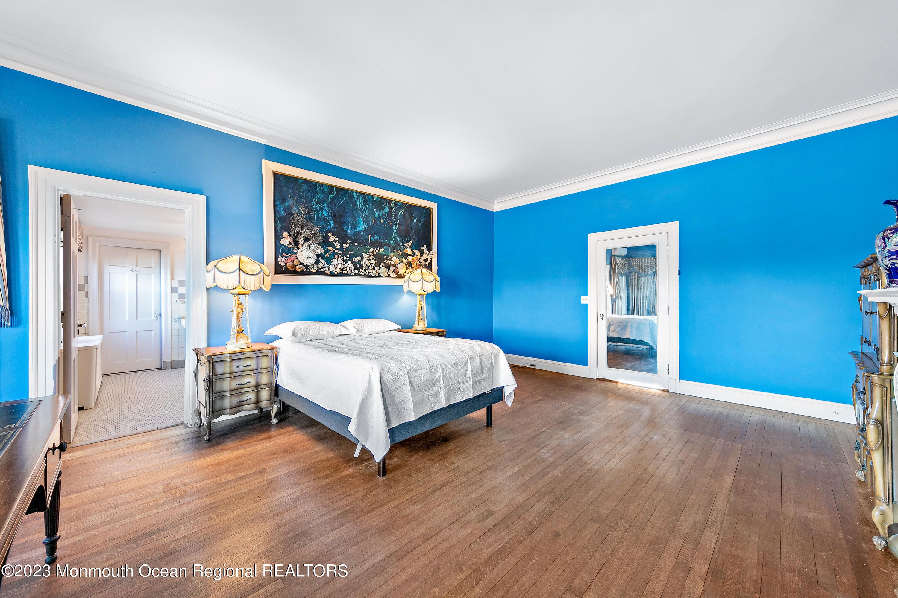 29 Hance Road Fair Haven, NJ 07704 - Photo 15 of 53 a bedroom with a large bed a table and painting on the wall
