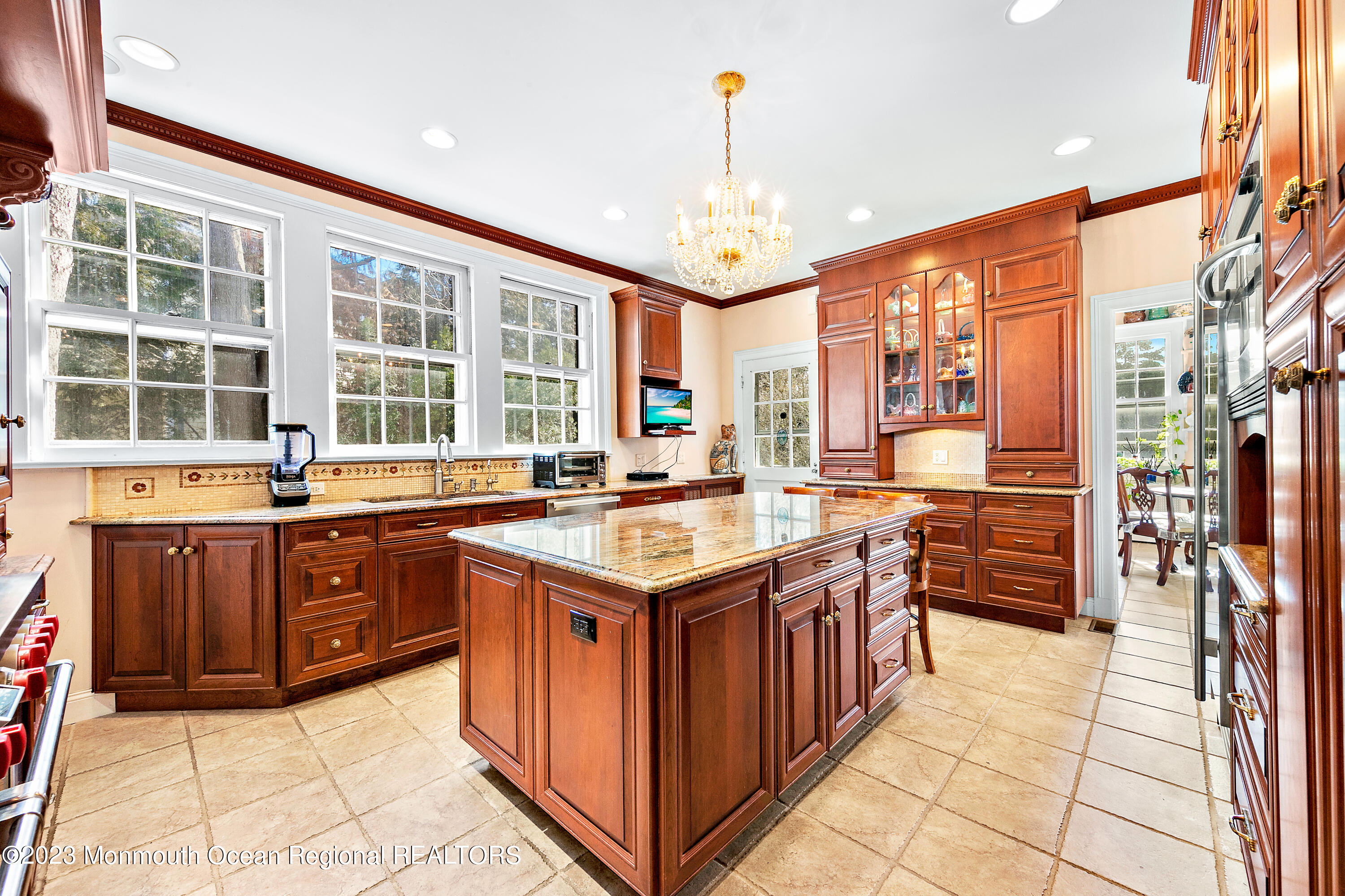 29 Hance Road Fair Haven, NJ 07704 - Photo 39 of 53 a kitchen with stainless steel appliances granite countertop stove top oven and cabinets