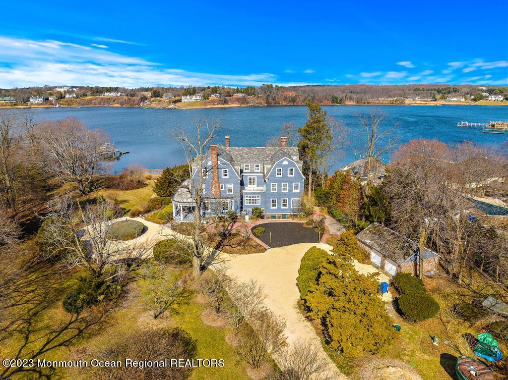 29 Hance Road Fair Haven, NJ 07704 - Photo 45 of 53 a view of a lake with a building in the background