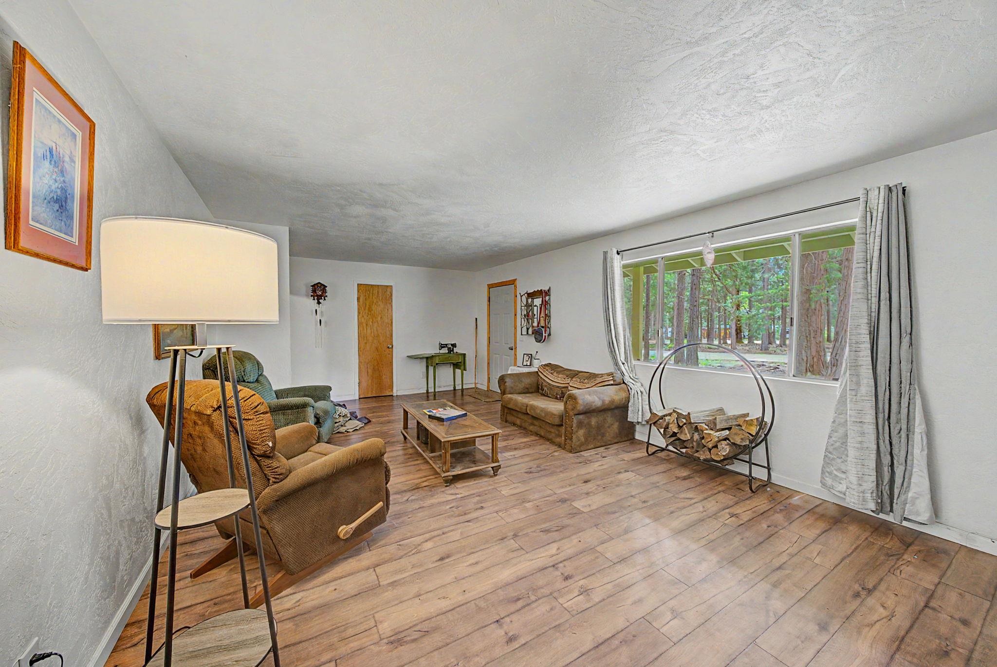 58374 Gill Ranch Road Cromberg, CA 96103 - Photo 21 of 44 a bed room with furniture and a window
