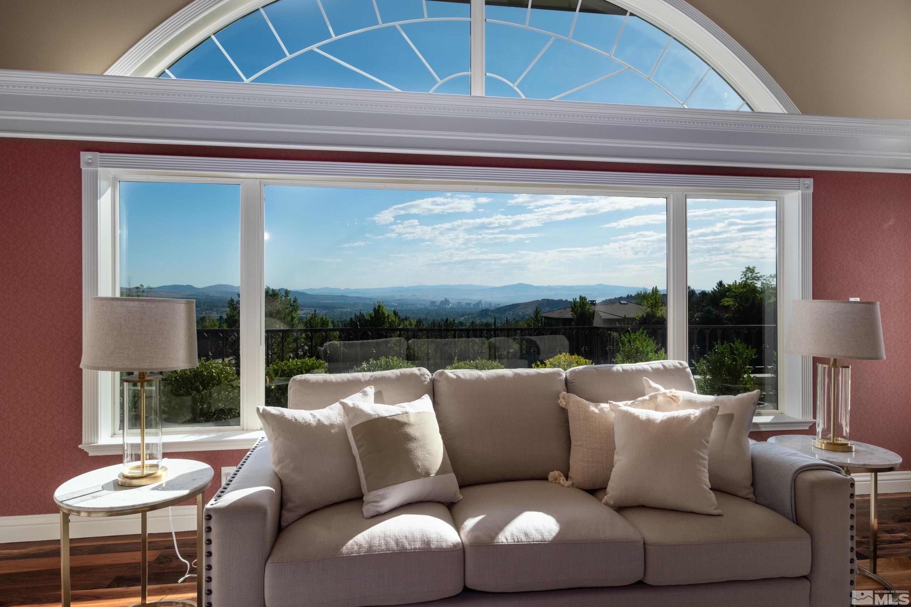 85 Hawken Road Reno, NV 89519 - Photo 8 of 40 a living room with furniture and a floor to ceiling window