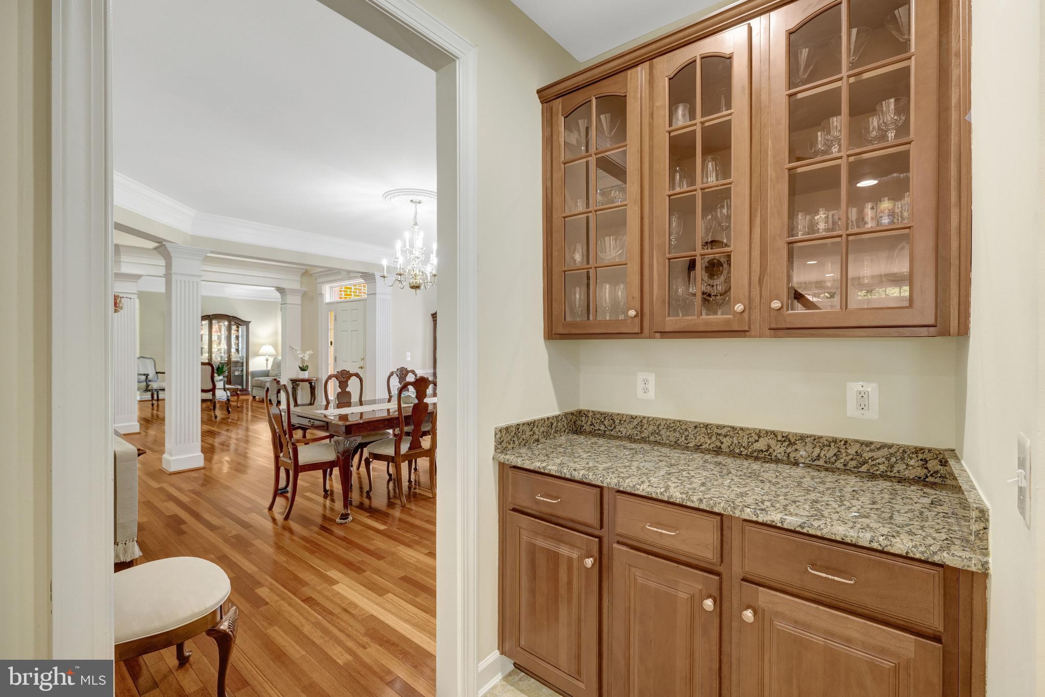 13650 Independence Ridge Nokesville, VA 20181 - Photo 30 of 98 Butler's Pantry with Glass Display Cabinets
