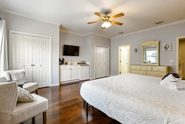 a bedroom with a bed and a table