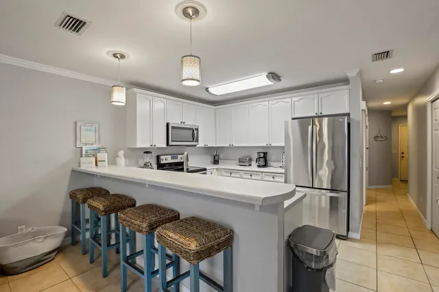 a living room with furniture and a ceiling fan