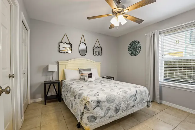 a bathroom with a double vanity sink toilet and shower