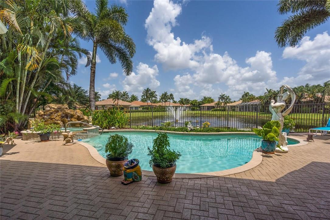 16391 Braeburn Ridge Trail Delray Beach, FL 33446 - Photo 24 of 31 Pool overlooking lake with fountain